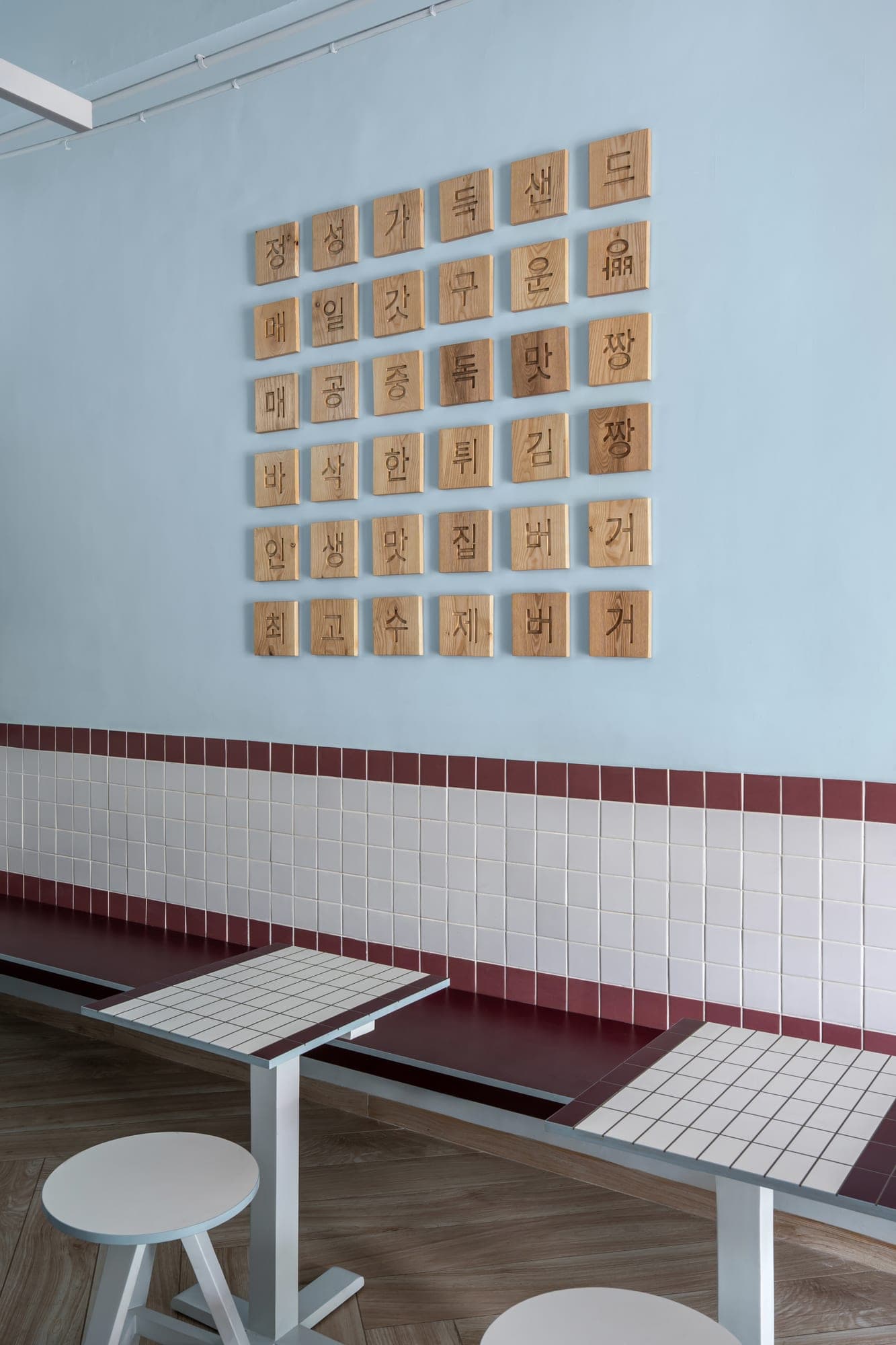 Inside Koja - Hangul wood tiles above the tiled banquette seating